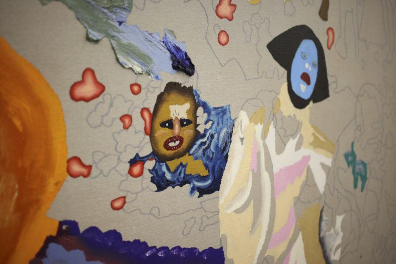 A close up of one of Cindy Phenix's paintings in progress, made with oil paint on linen. Two figures begin to emerge in the painting.